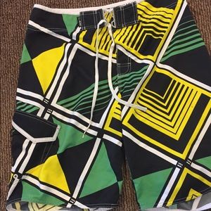 Green, black, and yellow Billabong board shorts